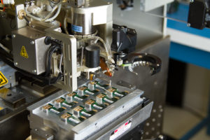 A pick and place machine made by Palomar Technologies