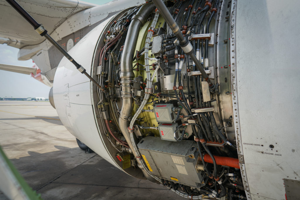 Fan cowl are opened to show inside an electric aircraft jet engine