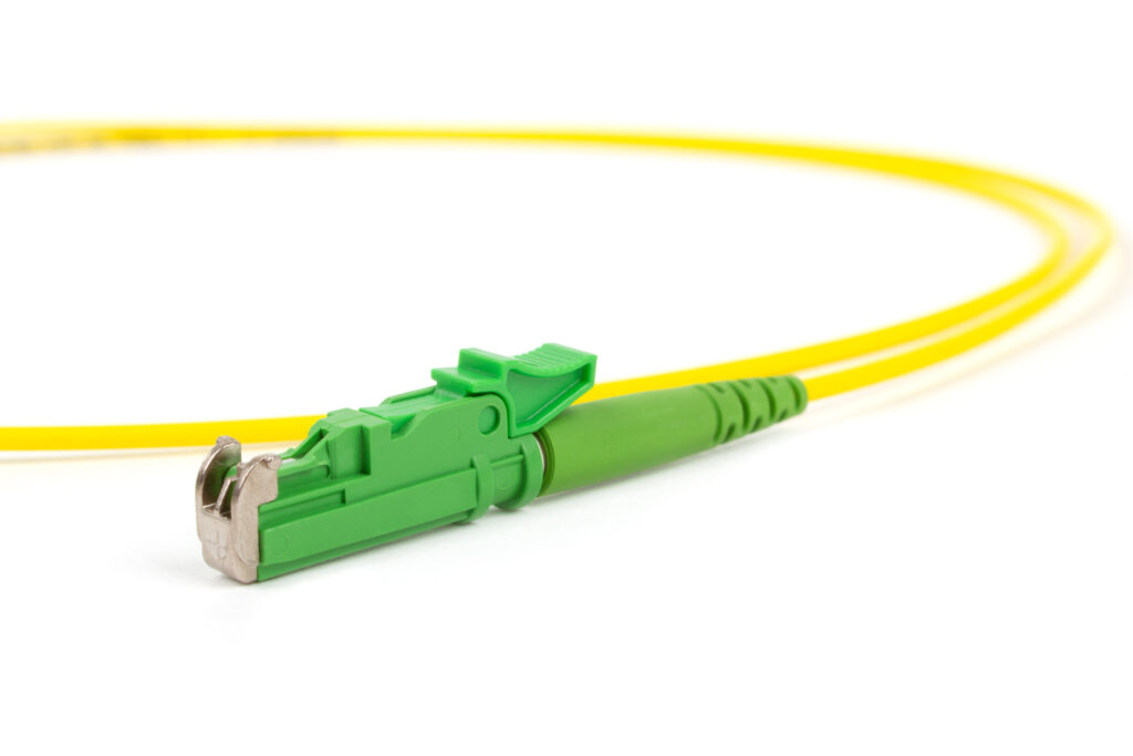 Green fiber optic cable with an SC connector.