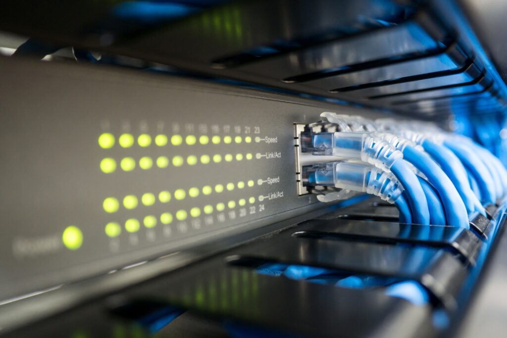 Ethernet cables connected to network box, demonstrating SWDM.