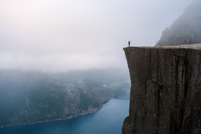 A person standing on the edge of a cliff.
